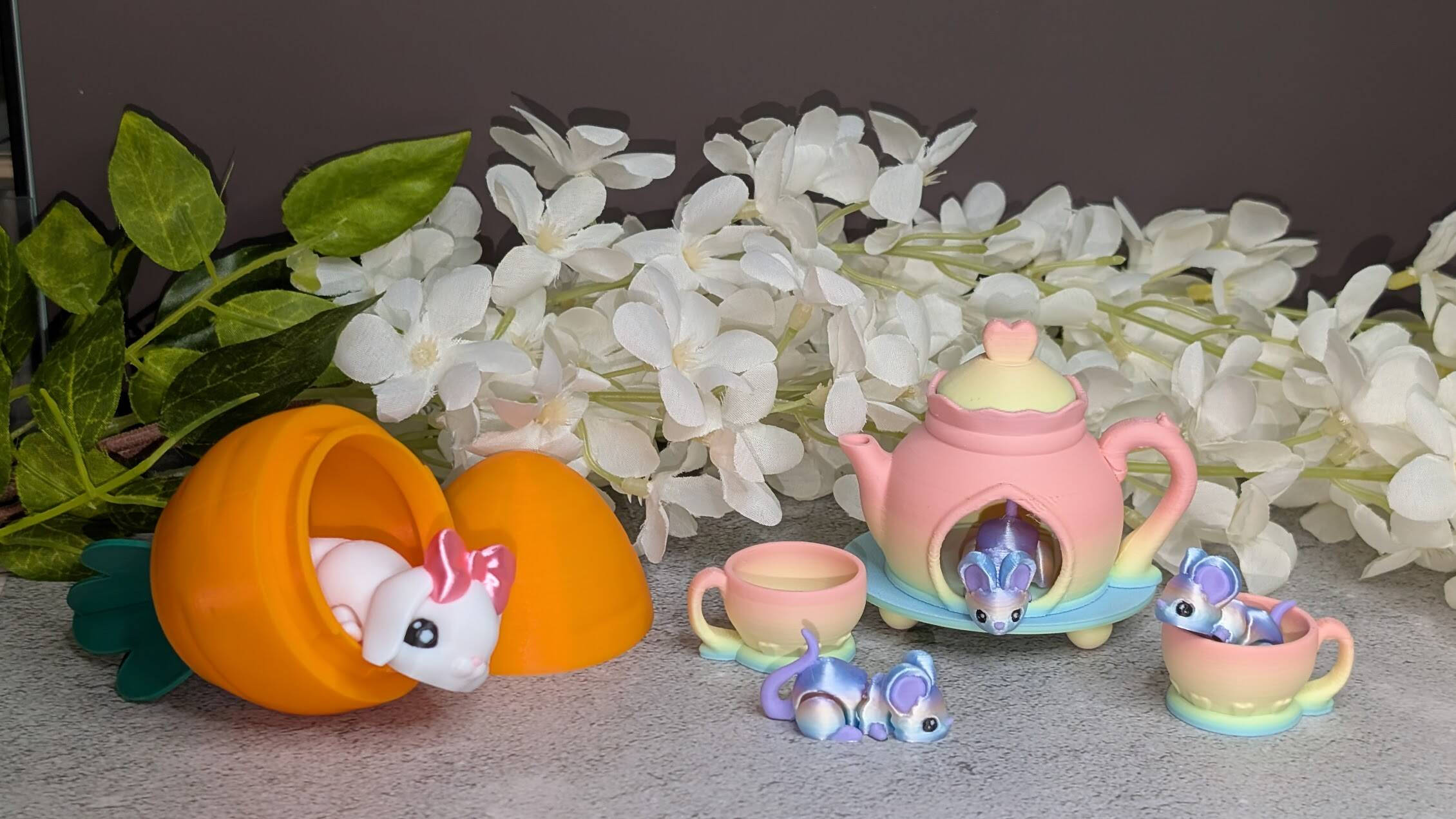 Pastel 3D-printed miniature mice tea set with teapot and cups